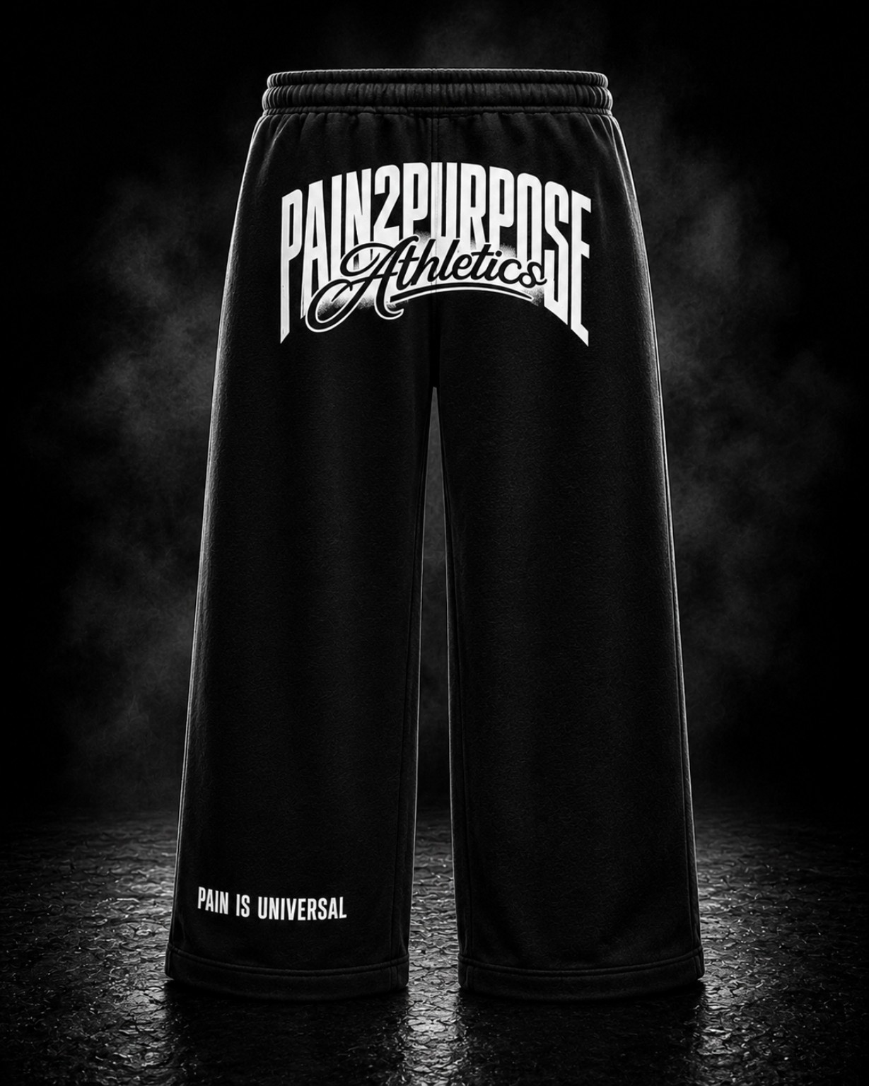 Front view of The Standard black wide-leg sweats with white Pain2Purpose Athletics branding